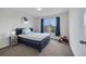 Comfortable bedroom with a large window, blue accents, and plenty of natural light at 4394 Devon Ct, Kissimmee, FL 34746