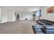 Large bonus room with plush carpet, offering ample space for entertaining, relaxing, and creating memories at 4394 Devon Ct, Kissimmee, FL 34746