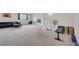 Spacious bonus room with plush carpeting, a comfortable seating area, and versatile space at 4394 Devon Ct, Kissimmee, FL 34746