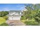 Charming two-story home featuring a three-car garage and well-maintained landscaping at 4394 Devon Ct, Kissimmee, FL 34746