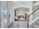 Inviting foyer with a view of the staircase and living room featuring an archway at 4394 Devon Ct, Kissimmee, FL 34746