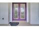 Stylish front door with decorative glass accents, covered porch, and seating area at 4394 Devon Ct, Kissimmee, FL 34746
