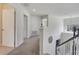 Upstairs hallway with carpeted floor and views of the staircase, bedrooms, and bathrooms at 4394 Devon Ct, Kissimmee, FL 34746