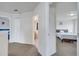 Hallway with views into multiple bedrooms and bathrooms, offering easy access throughout the upper level at 4394 Devon Ct, Kissimmee, FL 34746