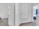 Hallway with carpet flooring, utility access, and views into the bedroom at 4394 Devon Ct, Kissimmee, FL 34746