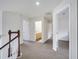 Upstairs hallway leading to bedrooms and bathroom areas, providing convenient access to the home's living spaces at 4394 Devon Ct, Kissimmee, FL 34746