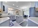 Bright kitchen with gray cabinets, island, and view of the adjacent dining area creates an inviting space at 4394 Devon Ct, Kissimmee, FL 34746