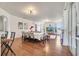 Spacious and bright living room with hardwood floors and sliding glass door to patio at 4394 Devon Ct, Kissimmee, FL 34746