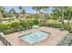 Relaxing neighborhood splash pad area features green lounge chairs and a mushroom shaped fountain at 4394 Devon Ct, Kissimmee, FL 34746