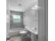 Bathroom featuring tiled shower over tub combination at 520 Sumner Ave, Orange City, FL 32763