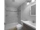 Modern bathroom with a tiled shower and updated fixtures at 520 Sumner Ave, Orange City, FL 32763