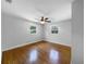 Bedroom with ceiling fan and two bright windows at 520 Sumner Ave, Orange City, FL 32763