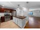 Renovated kitchen boasts stainless steel appliances and a center island at 520 Sumner Ave, Orange City, FL 32763