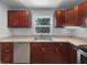 Stainless steel appliances and sleek countertops complete the updated kitchen at 520 Sumner Ave, Orange City, FL 32763