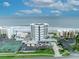 Coastal living showcasing a beachfront condo tower with tennis courts and ocean view at 5207 S Atlantic Ave # 225, New Smyrna Beach, FL 32169