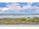 Breathtaking ocean view from this balcony overlooking the beach, dunes, and native vegetation at 5207 S Atlantic Ave # 225, New Smyrna Beach, FL 32169