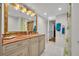 Well-lit bathroom featuring granite countertop vanity and a tiled walk-in shower at 5207 S Atlantic Ave # 225, New Smyrna Beach, FL 32169