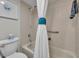Cozy bathroom featuring neutral tiles, a shower and bath, and a comfort height toilet at 5207 S Atlantic Ave # 225, New Smyrna Beach, FL 32169