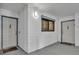 Hallway with a window and two doors, each with a welcome mat at 5207 S Atlantic Ave # 225, New Smyrna Beach, FL 32169