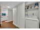 Convenient laundry closet with a washer and dryer adjacent to a bathroom at 5207 S Atlantic Ave # 225, New Smyrna Beach, FL 32169