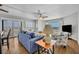 Living room with tiled floors and ocean views through a large window and sliding glass door at 5207 S Atlantic Ave # 225, New Smyrna Beach, FL 32169