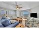 Cozy living room with nautical themed furniture and beautiful ocean views from the picture window at 5207 S Atlantic Ave # 225, New Smyrna Beach, FL 32169