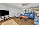 Open concept living area with mounted television, ocean view, and a beachy aesthetic at 5207 S Atlantic Ave # 225, New Smyrna Beach, FL 32169
