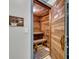 A wooden sauna room with wooden benches and flooring, offering a relaxing spa experience at 5207 S Atlantic Ave # 225, New Smyrna Beach, FL 32169