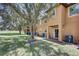 Spacious backyard of a two-story home with manicured lawn and trees at 528 Terra Lago St, Davenport, FL 33897
