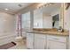 Bathroom showcasing a vanity with granite countertop and a shower-tub combo at 528 Terra Lago St, Davenport, FL 33897