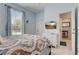 Serene bedroom featuring a large window and a TV, offering a peaceful retreat for relaxation and rest at 528 Terra Lago St, Davenport, FL 33897