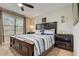 Bedroom offering large bed, ceiling fan, natural light and dark wood furniture at 528 Terra Lago St, Davenport, FL 33897