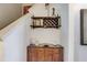 Stylish hallway nook with a wine rack and decorative elements, adding a touch of elegance and functionality to the space at 528 Terra Lago St, Davenport, FL 33897