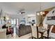 Bright and airy living area with dining space, flowing into a modern kitchen, perfect for entertaining and everyday living at 528 Terra Lago St, Davenport, FL 33897