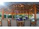 The Tiki bar with woven ceiling and several barstools in front of the counter at 528 Terra Lago St, Davenport, FL 33897