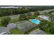 Complex amenities with pool, tennis courts, and landscaping near busy highway at 5635 Blue Shadows Ct # 3, Orlando, FL 32811