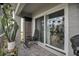Cozy tiled balcony area with sliding glass door and plenty of room for potted plants at 5635 Blue Shadows Ct # 3, Orlando, FL 32811