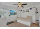 Bedroom featuring a comfortable daybed, a TV, and ample natural light from the window at 5635 Blue Shadows Ct # 3, Orlando, FL 32811