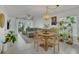Bright and open living space with dining area with lots of plants at 5635 Blue Shadows Ct # 3, Orlando, FL 32811