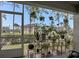 Screened-in patio with plants and a view of the landscaped community at 5635 Blue Shadows Ct # 3, Orlando, FL 32811