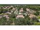 View of a neighborhood with tree-lined streets and well-maintained homes at 5683 Bassett Pl, Sanford, FL 32771