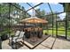 Covered outdoor living space featuring comfortable seating at 5683 Bassett Pl, Sanford, FL 32771