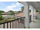Picturesque balcony view showcases a tranquil residential neighborhood, mature trees, and bright blue skies at 5683 Bassett Pl, Sanford, FL 32771
