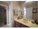 Clean bathroom featuring a large mirror, and access to the bath and en-suite at 5683 Bassett Pl, Sanford, FL 32771