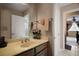 Clean bathroom featuring a spacious vanity, bright lighting and a door to the en-suite at 5683 Bassett Pl, Sanford, FL 32771