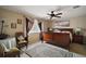 Bright bedroom featuring a ceiling fan, natural light and attractive decor at 5683 Bassett Pl, Sanford, FL 32771