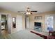 Spacious bedroom with a ceiling fan and convenient access to the en-suite bath at 5683 Bassett Pl, Sanford, FL 32771