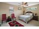 Bedroom featuring a ceiling fan and cozy seating next to a window at 5683 Bassett Pl, Sanford, FL 32771