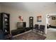 Comfortable living room space with television, bookshelves and comfortable seating at 5683 Bassett Pl, Sanford, FL 32771