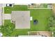 Aerial view of the property with a large yard and a trampoline at 7469 Hunters Greene Cir, Lakeland, FL 33810